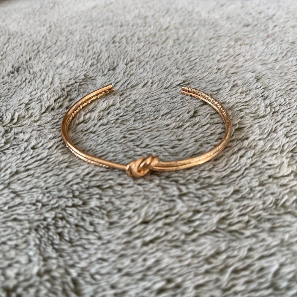 Gold knot bangle bracelet
